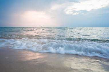 Landscape Long exposure of majestic clouds in the sky sunset or sunrise over sea with reflection in the tropical sea.Beautiful cloudscape scenery.Amazing light of nature Landscape nature background