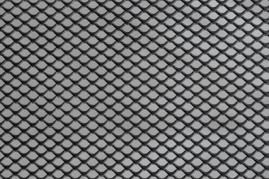 Siyah arkaplanda düzenli desenli metal ızgara