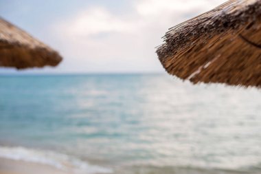 Beautiful tropical beach with white sand and palapa (thatched roof) in the Caribbean, Mexico. Summer beach background.