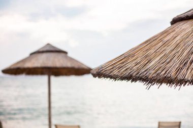 Beautiful tropical beach with white sand and palapa (thatched roof) in the Caribbean, Mexico. Summer beach background.