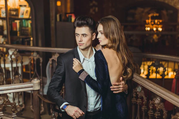 Sexual passionate couple in elegant evening dresses. Luxurious interior. Fashion shot.