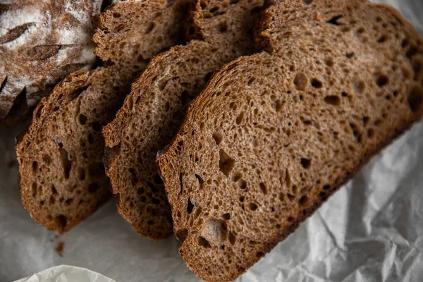 stock image Healthy rye bread slices on the plate on concrete background