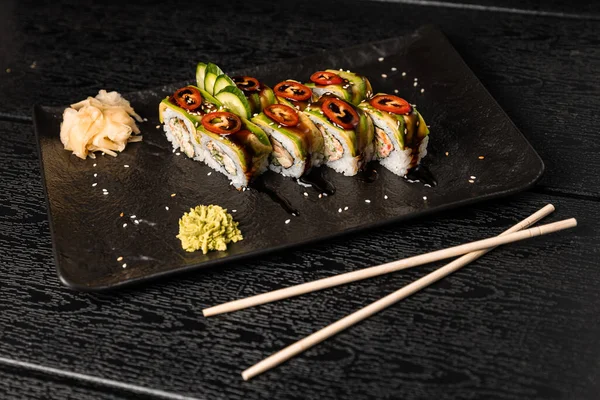 sushi food. Maki ands rolls with tuna, salmon, shrimp, crab and avocado. Top view of assorted sushi. Rainbow sushi roll, uramaki, hosomaki and nigiri.