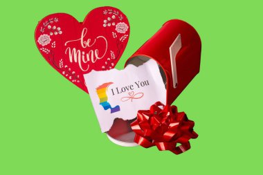 A red mailbox surrounded by heart-shaped decorations, perfect for Valentines Day. Green screen background clipart