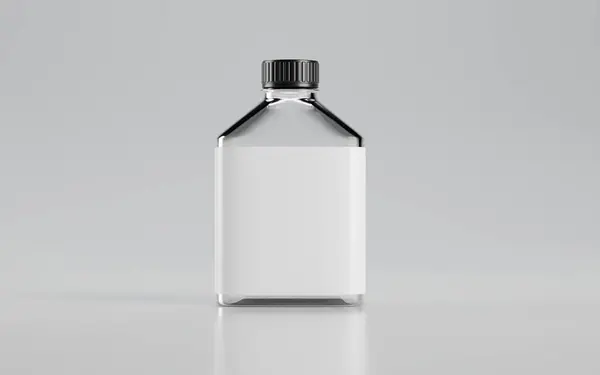 Masada beyaz etiketli cam bir şişe.