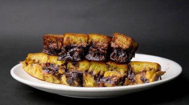 close up of sweet martabak or pancakes with peanuts and melted chocolate inside clipart