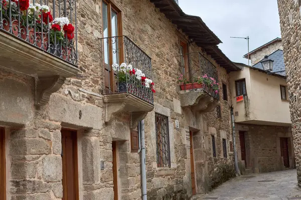 stock image Old village with picturesque stone buildings and flowers in Puebla de Sanabria, Zamora province, Castilla y Leon, Spain