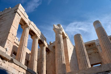 Propylaea on the Acropolis of Athens, Greece, Europe. This ancient entrance to the Acropolis is a famous monument of Athens. Classical Greek architecture of Athens. Ancient ruins in the center of Athens. clipart