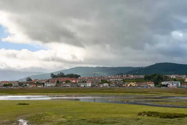 stock image View of the houses of an urbanization at the mouth of the minor river in Ramallosa at low tide in A Foz Ramallosa Galicia Spain