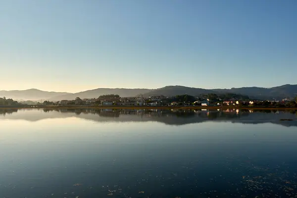 stock image Stunning Foz del Mior Vista from Camping Playa Ladeira During High Tide. The elevated vantage point from the campsite offers a sweeping view of this natural wonder, where the meeting of river and sea creates a picturesque and serene landscape