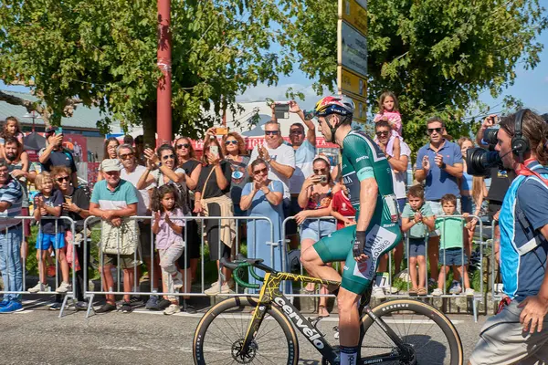 stock image Bayona,Pontevedra,Spain; August,27,2024;thrilling moment as cyclists cross the finish line in Bayona during a stage of the Vuelta a Espaa. The atmosphere is electric with spectators cheering and the riders pushing through the final meters after a g