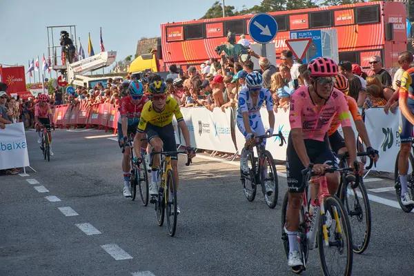 stock image Bayona,Pontevedra,Spain; August,27,2024;thrilling moment as cyclists cross the finish line in Bayona during a stage of the Vuelta a Espaa. The atmosphere is electric with spectators cheering and the riders pushing through the final meters after a g