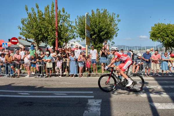 stock image Bayona,Pontevedra,Spain; August,27,2024;thrilling moment as cyclists cross the finish line in Bayona during a stage of the Vuelta a Espaa. The atmosphere is electric with spectators cheering and the riders pushing through the final meters after a g