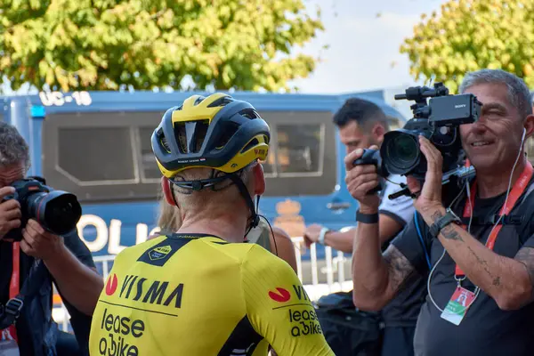 stock image Bayona,Pontevedra,Spain; August,27,2024 Moments immediately following the cyclists' arrival at the finish line in Bayona during the Vuelta a Espaa. The riders, exhausted yet relieved, rehydrate and catch their breath after the intense stage.