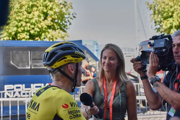 stock image Bayona,Pontevedra,Spain; August,27,2024 Moments immediately following the cyclists' arrival at the finish line in Bayona during the Vuelta a Espaa. The riders, exhausted yet relieved, rehydrate and catch their breath after the intense stage.