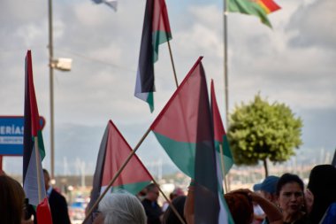 Bayona,Pontevedra,Spain; August,27,2024; presence of Palestinian flags raised in protest at the finish line of the Vuelta a Espaa. The display of the flags symbolizes a statement of solidarity and political expression during this major international clipart