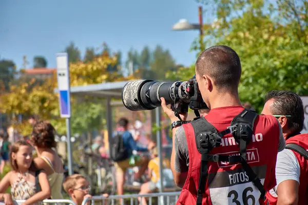 stock image Bayona,Pontevedra,Spain; August,27,2024; A group of professional photographers poised with their cameras, eagerly awaiting the final moments of a sporting event.