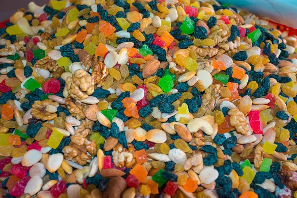 stock image This closeup captures the vivid array of spices available at Chorsu Bazaar in Tashkent, Uzbekistan. The market is renowned for its rich display of colorful spices, ranging from deep reds to bright yellows and earthy browns.