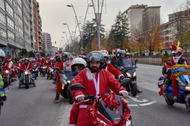 Vigo,Pontevedra,Spain December,21,2024:The Papanoelada motera in Vigo is an annual festive motorcycle parade where thousands of riders take to the streets dressed in creative Christmas-themed costumes.  clipart