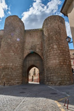 Puerta de Herreros, one of the entrances to the ancient walls of Almazan, in the province of Soria, Castile and Leon, Spain. The structure is composed of sturdy cylindrical towers on either side of a stone