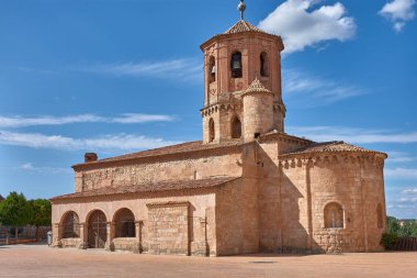 The Church of San Miguel de Almazan, in the province of Soria, Castile and Leon, Spain, features its distinctive octagonal tower and robust construction of reddish stone and Arabic tiles. 