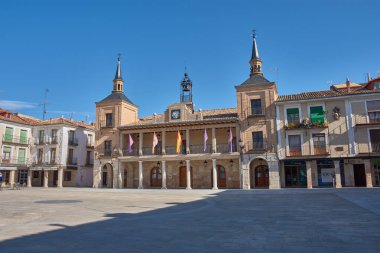 Burgo de Osma, Spain - September 9, 2025,The Plaza Mayor of El Burgo de Osma, in the province of Soria, Castile and Leon, Spain, with the imposing Town Hall (Casa Consistorial) in the foreground. The Baroque architecture of the town hall