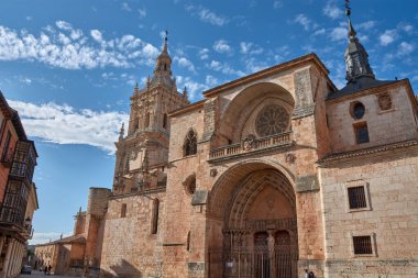 Burgo de Osma, Spain - September 9, 2025,Cathedral of the Assumption of El Burgo de Osma, in the province of Soria, Castile and Leon. Spain, with its majestic Gothic tower and elaborate gilded stone facade. 