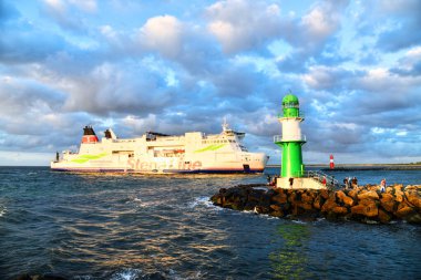 The ferry arrives from Denmark to Rostock. clipart