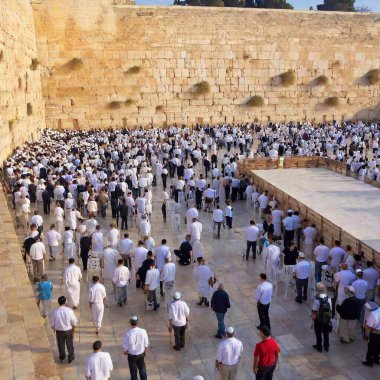 Thousands of people pray at the Western Wall in Jerusalems Old City during Yom Kippur clipart