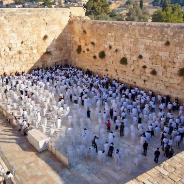 Thousands of people pray at the Western Wall in Jerusalems Old City during Yom Kippur clipart