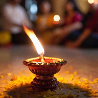 Create an image of a Diwali prayer ceremony from a ground-level angle, using an establishing shot with rack focus. Begin with sharp focus on a diya flame in the foreground, then transition to the family praying in the background clipart