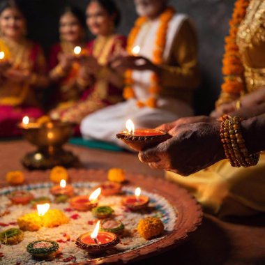 Design a shoulder-level medium long shot of senior males and females performing Diwali prayers, using shallow focus to create a gentle blur in the background, while the participants and the prayer items in the foreground are sharply defined clipart