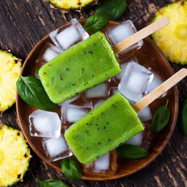 homemade ice cream with mint, mint and pineapple in a glass. summer dessert. top view. clipart