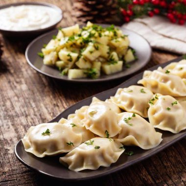 close up image of Mushroom and cabbage pierogi. Polish Christmas Eve dinner at eye level, focusing on meal clipart