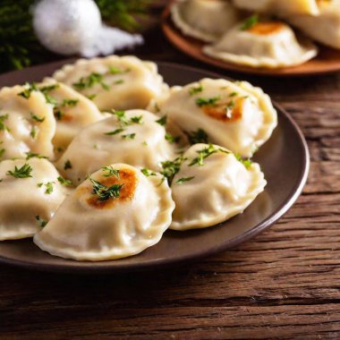 close up image of Mushroom and cabbage pierogi. Polish Christmas Eve dinner at eye level, focusing on meal clipart