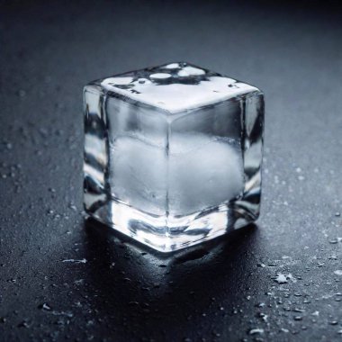 cinematographic image widescreen of a translucid ice cube with black background clipart