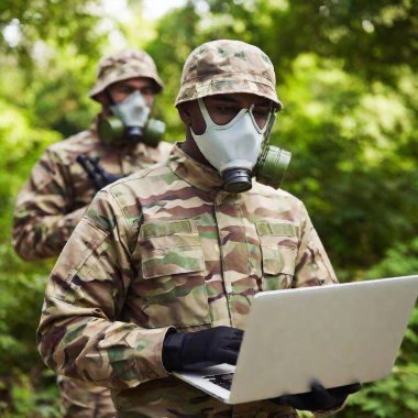 soldiers with gas masks and laptop computer in the jungle clipart