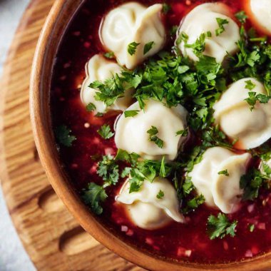 A macro flatlay of a Polish Wigilia table focusing on a close-up view of traditional Polish Christmas Eve dishes, such as borscht with a floating mushroom dumpling, showing the fine details and textures clipart