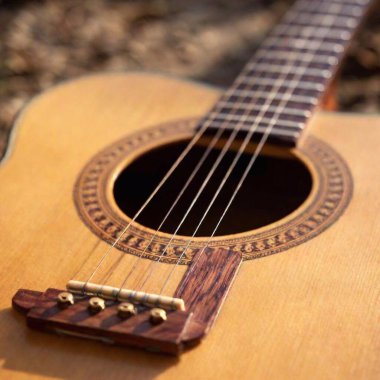 acoustic guitar on a wooden background clipart