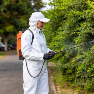 man in protective suit spraying spray on his face in park, spraying chemicals, sprayer clipart