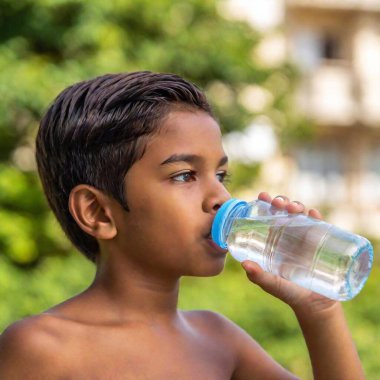 latin boy drinking water clipart