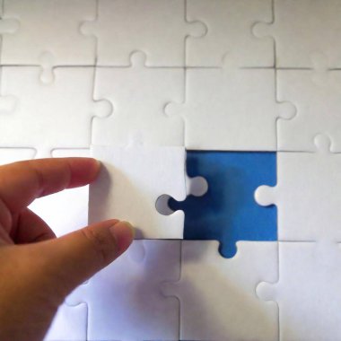 jigsaw puzzle pieces on blue background clipart