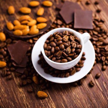 cup of coffee and chocolate on a wooden table. selective focus. clipart