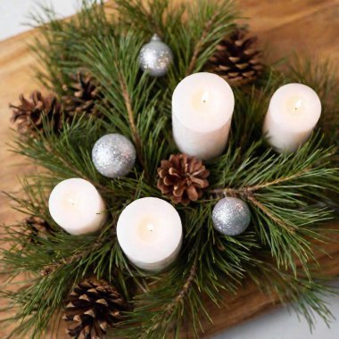 christmas decoration with candles and cones