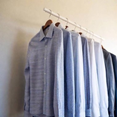 a vertical closeup of blue shirt on the hanger clipart