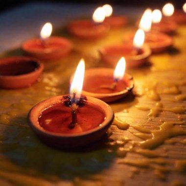 Close-Up Flatlay of Dripping Wax from Many Candles: A close-up flatlay image focusing on the wax drips from a multitude of burning candles, using deep focus to capture the detailed textures and smooth flow of the melted wax. clipart