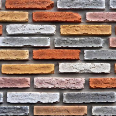 a brick wall texture background that features a layered, painted effect. Show bricks with distressed paint, revealing original brick colors underneath and giving a worn, artistic vibe clipart