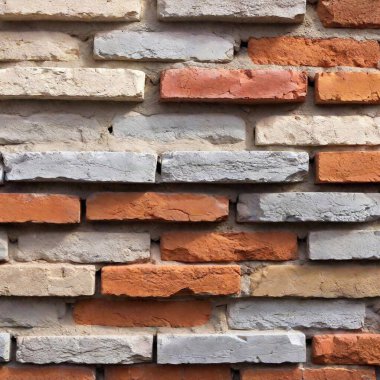 a brick wall texture background that features a layered, painted effect. Show bricks with distressed paint, revealing original brick colors underneath and giving a worn, artistic vibe clipart