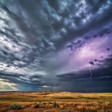 An eye-level wide shot of a dramatic stormy sky, captured over a flat prairie. The scene shows dark, swirling clouds dominating the sky, with lightning streaking across the horizon and a few distant storm clouds illuminated by flashes of light. clipart