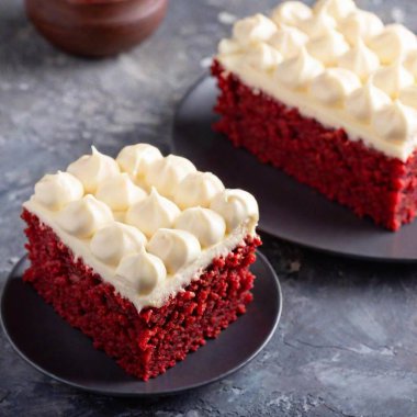 A top-down perspective of a slice of red velvet cake with creamy frosting, with the cake in sharp focus and the table surface and background softly fading into a blurred backdrop clipart